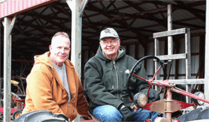 Two farmers and a tractor.